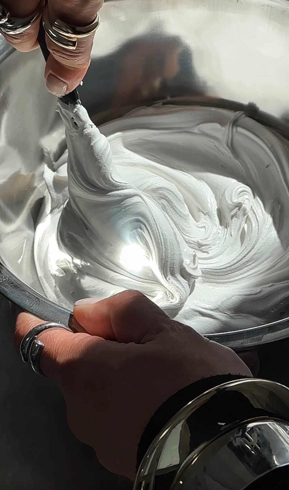 The Cream whipped to stiff peaks in a steel bowl